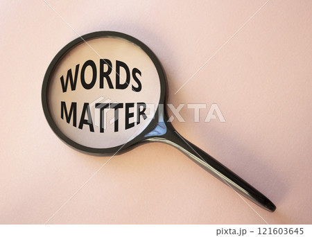 Words Matter symbol. Magnifying Glass with Concept word Words Matter. Beautiful pink background. Business and Words Matter concept. Copy space 121603645