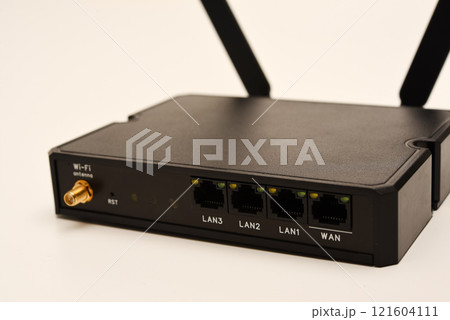 GSM modem. An Internet station with a SIM card. A black router on a white background. GSM modem. An Internet station with a SIM card. A black router on a white background. 121604111