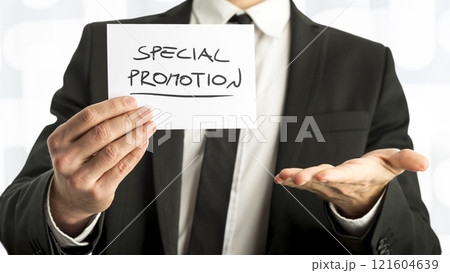 Close up Businessman or Salesman Holding Small Paper with Special Promotion  Message 121604639
