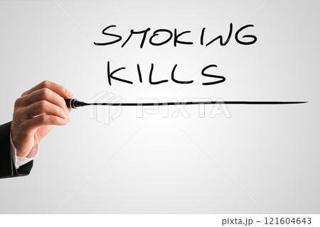 Close up of the hand of a man writing Smoking kills 121604643