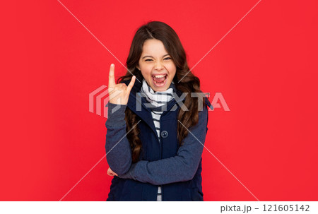 portrait of child wearing warm clothes. express positive emotion. winter fashion. 121605142