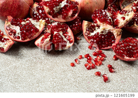 Ripe pomegranates, peeled and whole, the concept of benefits and vitamins in fruit. Ripe pomegranates, peeled and whole, the concept of benefits and vitamins in fruit. 121605199