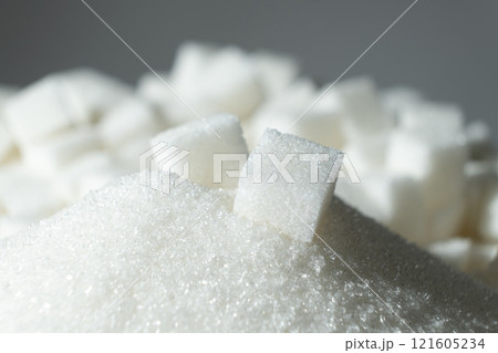 White refined beet sugar in the form of crystals and cubes. 121605234