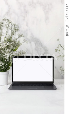 Blank laptop sleeve mockup displayed on a minimalist desk with decorative flowers in the background 121605437