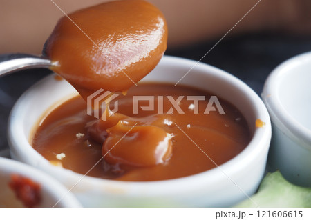 Delicious Caramel Sauce Served in an Elegant Small Serving Dish for You Delicious Caramel Sauce Served in an Elegant Small Serving Dish for You 121606615