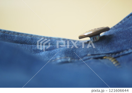 A Detailed CloseUp View of a Button and Zipper on Denim Jeans 121606644