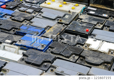 Stack of many used car batteries for recycling in a hazardous waste facility Stack of many used car batteries for recycling in a hazardous waste facility 121607155