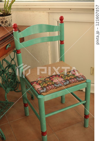 Boho chair makeover. Retro chair repainted in green color and reupholstery Boho chair makeover. Retro chair repainted in green color and reupholstery 121607857