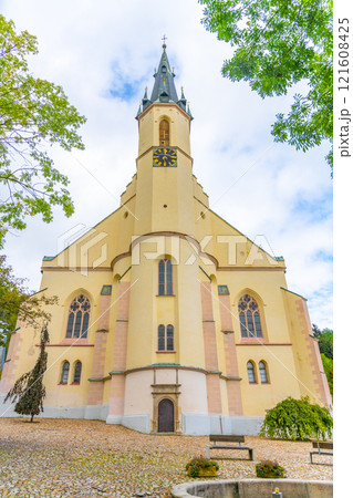 St. Joachim Church stands majestically in Jachymov, Czechia, showcasing its elegant architecture and historical significance against a serene sky, inviting visitors to explore its beauty. 121608425