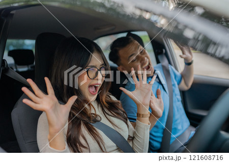 Joyful Moments Friends Singing Together and Having Fun on a Leisurely Car Ride 121608716