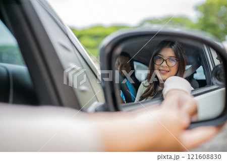 Joyful Road Trip Moment A Young Woman Enjoys a Fun Vibe Inside the Car 121608830