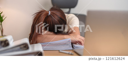 Stressed Asian woman having Tired and Sleepy while working, female businesswoman using laptop with headache at office, Exhausted woman with computer at home late night. Overload and Overworked Stressed Asian woman having Tired and Sleepy while working, female businesswoman using laptop with headache at office, Exhausted woman with computer at home late night. Overload and Overworked 121612624
