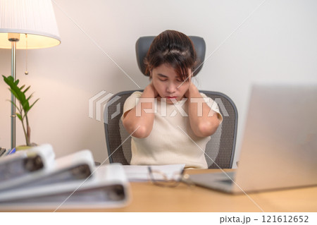 Woman having Neck and Shoulder pain during work long time on workplace. due to fibromyalgia, rheumatism, Scapular pain, office syndrome and ergonomic concept 121612652