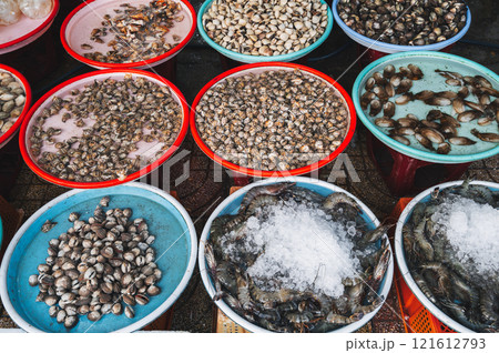 Fresh edible snails at a local market Fresh edible snails at a local market 121612793