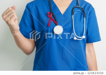Doctor with Burgundy Red Ribbon for March multiple myeloma Cancer and December World Aids Day Awareness month. Healthcare and world cancer day concept Doctor with Burgundy Red Ribbon for March multiple myeloma Cancer and December World Aids Day Awareness month. Healthcare and world cancer day concept 121613310