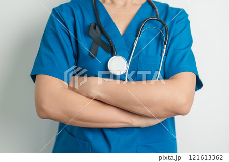 Melanoma and skin cancer, Vaccine injury awareness month and rest in peace concepts. doctor holding black Ribbon 121613362
