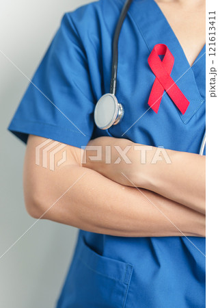 Doctor with Red Ribbon for December World Aids Day, acquired immune deficiency syndrome, multiple myeloma Cancer Awareness month and National Red ribbon week. Healthcare and world cancer day concept 121613411