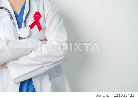 Doctor with Red Ribbon for December World Aids Day, acquired immune deficiency syndrome, multiple myeloma Cancer Awareness month and National Red ribbon week. Healthcare and world cancer day concept 121613423