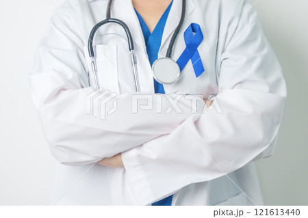 March Colorectal Cancer Awareness month, doctor with dark Blue Ribbon for supporting people living and illness. Healthcare, hope and World cancer day concept March Colorectal Cancer Awareness month, doctor with dark Blue Ribbon for supporting people living and illness. Healthcare, hope and World cancer day concept 121613440