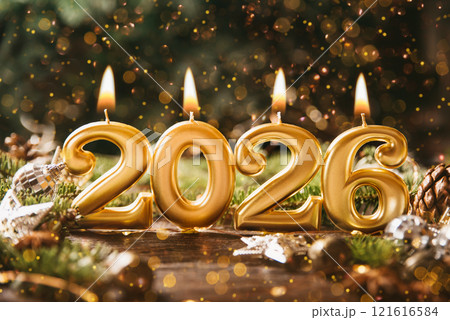 Holiday background Happy New Year 2026. Numbers of year 2026 made by gold burning candles on bokeh festive sparkling background. celebrating New Year holiday, close-up. Space for text 121616584