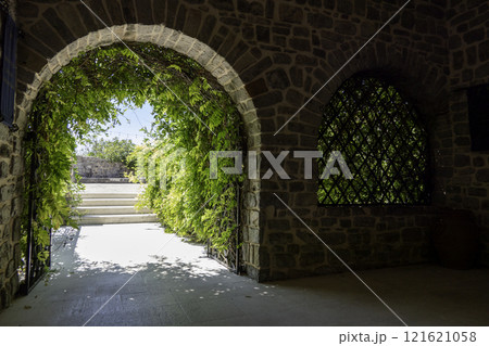 Montenegro, Budva, Flowered entrance leading to the courtyard of the citadel 121621058