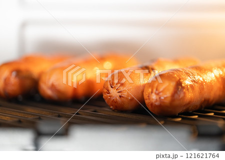 grilled sausages in the oven grilled sausages in the oven 121621764