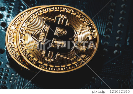golden bitcoin cryptocurrency coin on electronic chip background 121622190
