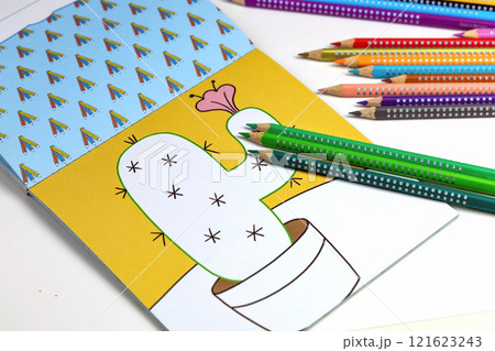 Colored pencils for drawing various colors and coloring book for children. Colored pencils for drawing various colors and coloring book for children. 121623243