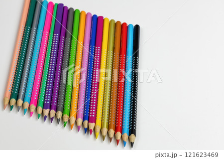 Colored pencils for drawing various colors and coloring book for children. 121623469