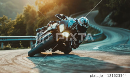 Motorcycle rider leaning into a curve, Man on a motorbike at high speed leaning in the curve, Racing sport Motorcycle rider leaning into a curve, Man on a motorbike at high speed leaning in the curve, Racing sport 121623544