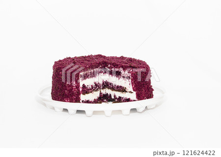 Red Velvet Cake is a traditional red chocolate cake with white buttercream on white background Red Velvet Cake is a traditional red chocolate cake with white buttercream on white background 121624422