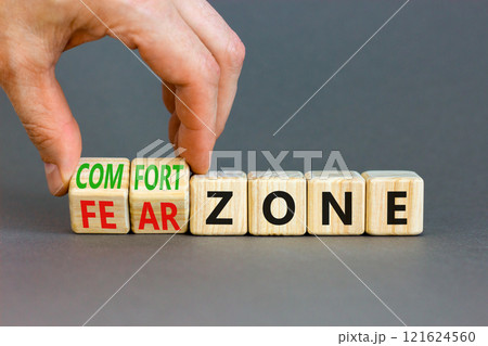 Comfort or fear zone symbol. Concept words Comfort zone Fear zone on wooden cubes. Beautiful grey table grey background. Psychologist hand. Business and comfort or fear zone concept. Copy space. Comfort or fear zone symbol. Concept words Comfort zone Fear zone on wooden cubes. Beautiful grey table grey background. Psychologist hand. Business and comfort or fear zone concept. Copy space. 121624560