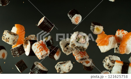 Freeze Motion Shot of Fresh Sushi Flying in the Air , Close-up 121625758