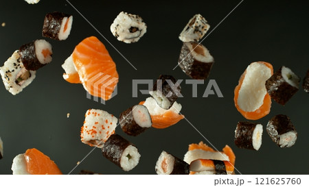 Freeze Motion Shot of Fresh Sushi Flying in the Air , Close-up Freeze Motion Shot of Fresh Sushi Flying in the Air , Close-up 121625760