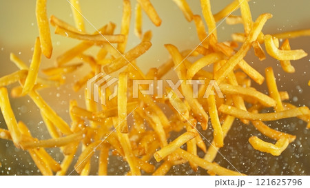 Freeze motion of flying french fries on gradient background 121625796