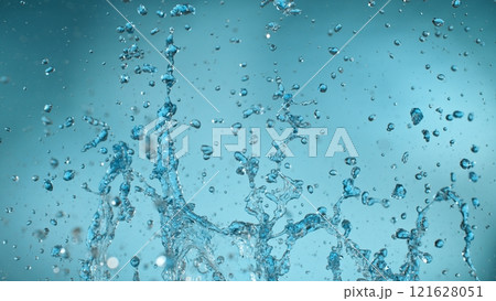 Freeze motion of splashing water on light blue background 121628051