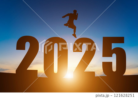 Happy New Year Numbers 2025, Silhouette a man handsome jumping feels happy moving early morning sunrise over the horizon background, Health and Happy new year concept. 121628251