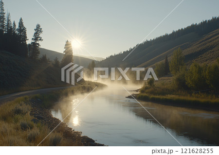 Serene Morning at Tranquil Lake Surrounded by Lush Pine Trees in Misty Atmosphere 121628255