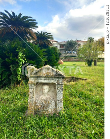 Ancient grave with tombstone under excavation Ancient grave with tombstone under excavation 121628311