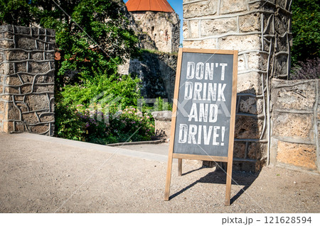 Don't Drink And Drive. Chalkboard advertising sign in an urban environment Don't Drink And Drive. Chalkboard advertising sign in an urban environment 121628594