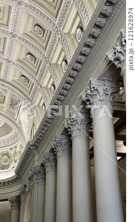 Intricate Architectural Ceiling and Pillars of a Historic Building Interior 121628974