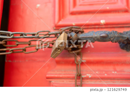 Closeup of metallic chains and locks in handles on Closeup of metallic chains and locks in handles on 121629749