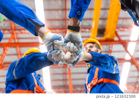 Teamwork engineer fist bump joining hands connection and partners together. Collaboration, construction work, goals, success. Teamwork engineer fist bump joining hands connection and partners together. Collaboration, construction work, goals, success. 121632300