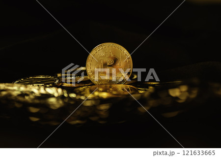 Bitcoin coins on a black background. Currency of the future. The world crisis Bitcoin coins on a black background. Currency of the future. The world crisis 121633665