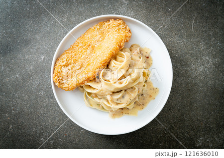 fettuccine pasta white cream sauce with fried fish fettuccine pasta white cream sauce with fried fish 121636010