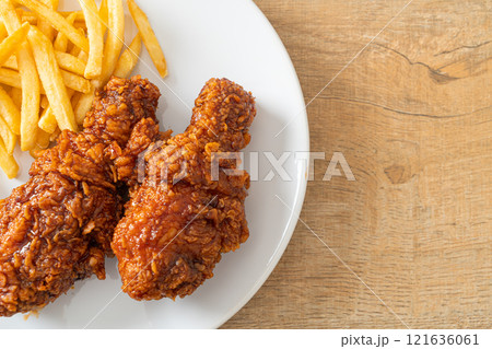 spicy Korean fried chicken with fries spicy Korean fried chicken with fries 121636061
