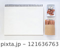 Minimalist Creative Workspace with Art Supplies and Blank Sketchpad 121636763