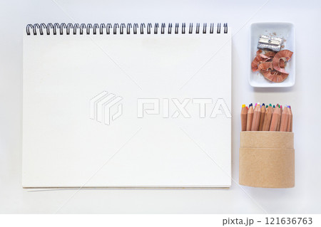 Minimalist Creative Workspace with Art Supplies and Blank Sketchpad 121636763