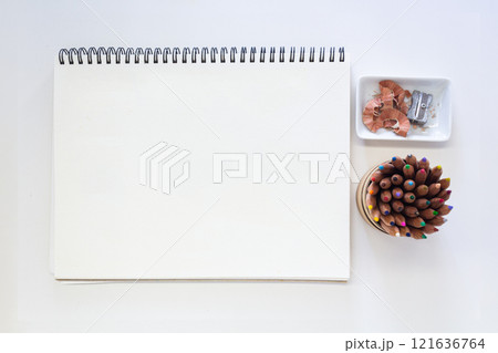 Minimalist Creative Workspace with Art Supplies and Blank Sketchpad 121636764