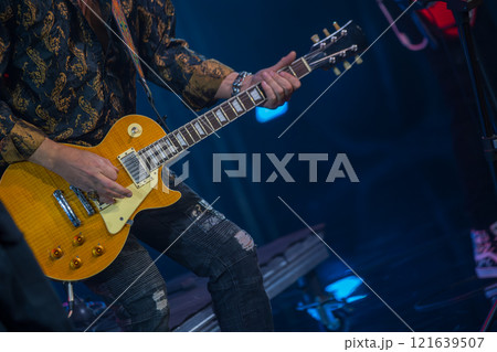Musician playing electric guitar during live rock concert Musician playing electric guitar during live rock concert 121639507